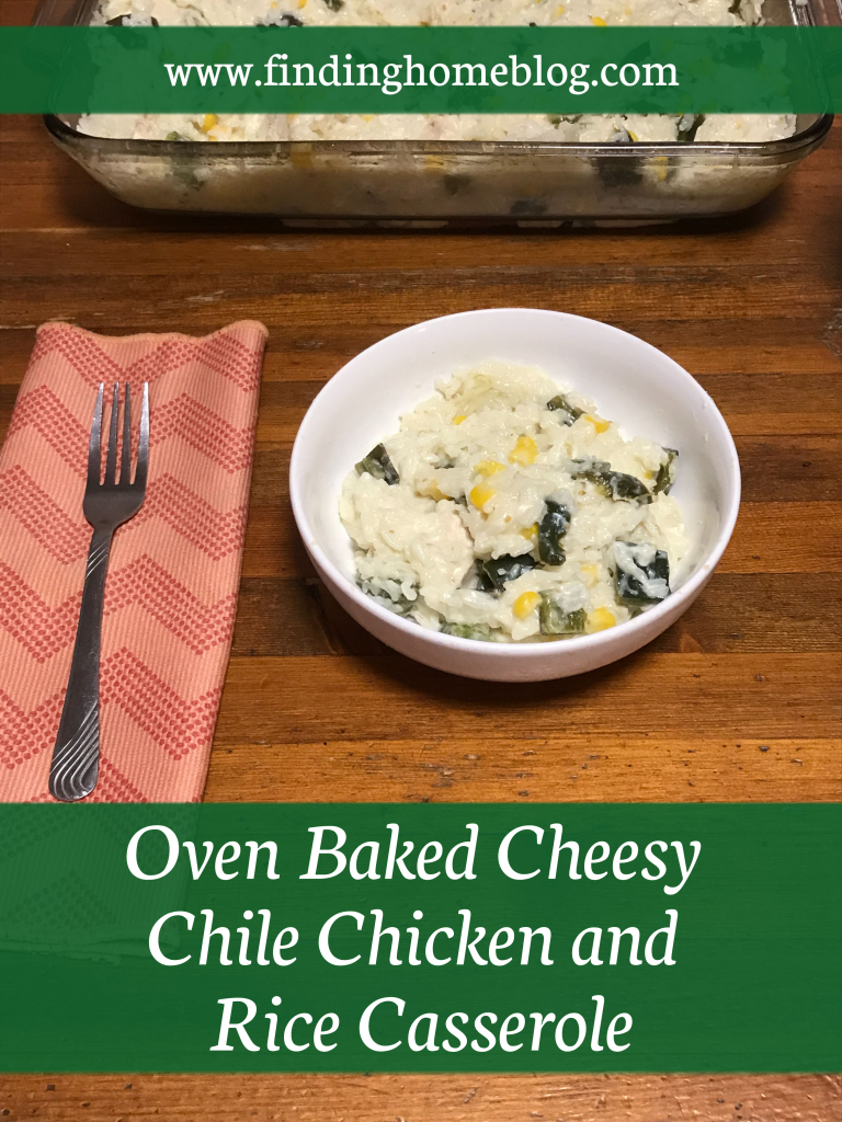 A bowl with a rice casserole in the foreground; a cloth napkin and fork off to the left. A 13x9 pan with more casserole in the background.