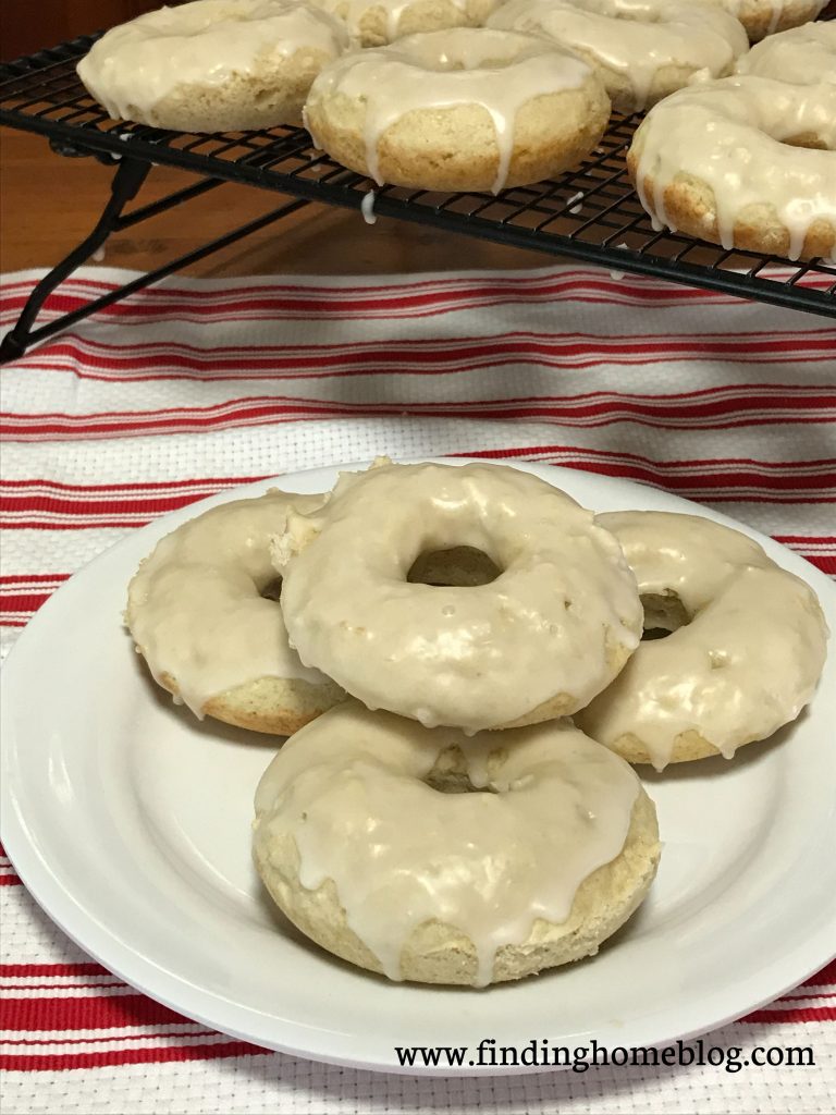 Close up of a plate of glazed cake donuts