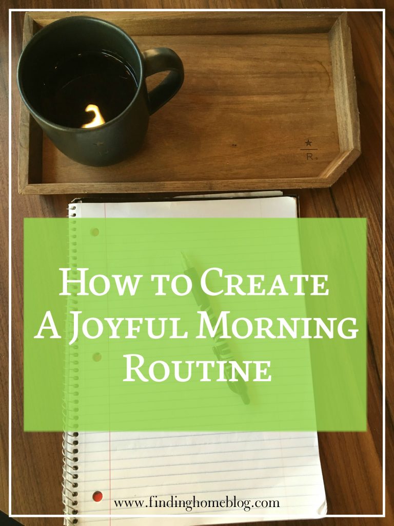 A tray with a mug of coffee on it, along with an open notebook and a pen. A banner reads, "How to Create a Joyful Morning Routine"